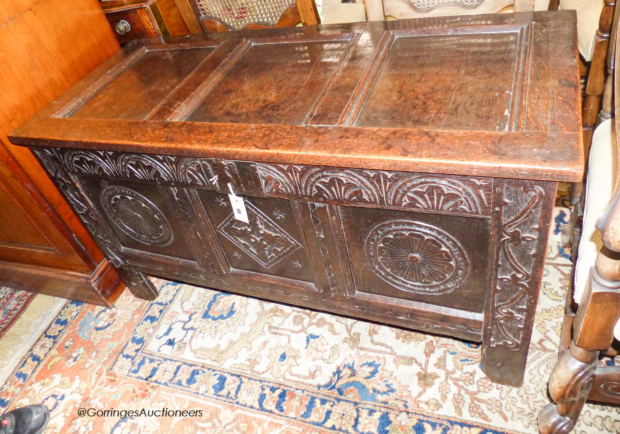 A late 17th century carved and panelled oak coffer, length 118cm, depth 52cm, height 64cm